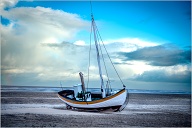 There are still a few places in Denmark where they pull the fishing boats up on the beach instea of using a barbour.